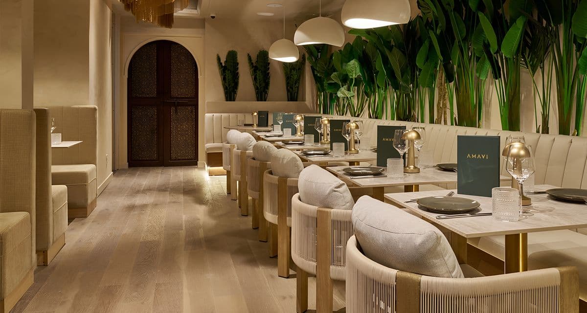 marble-top dining tables with tropical plant backdrop