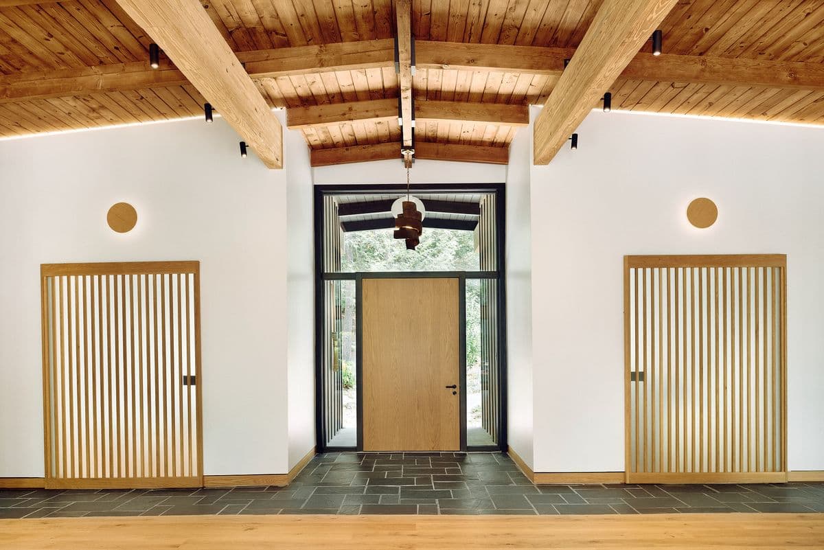 main entryway with wood doors