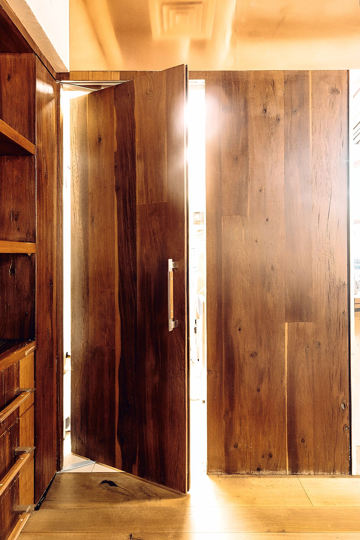 pivoting full-height wood door