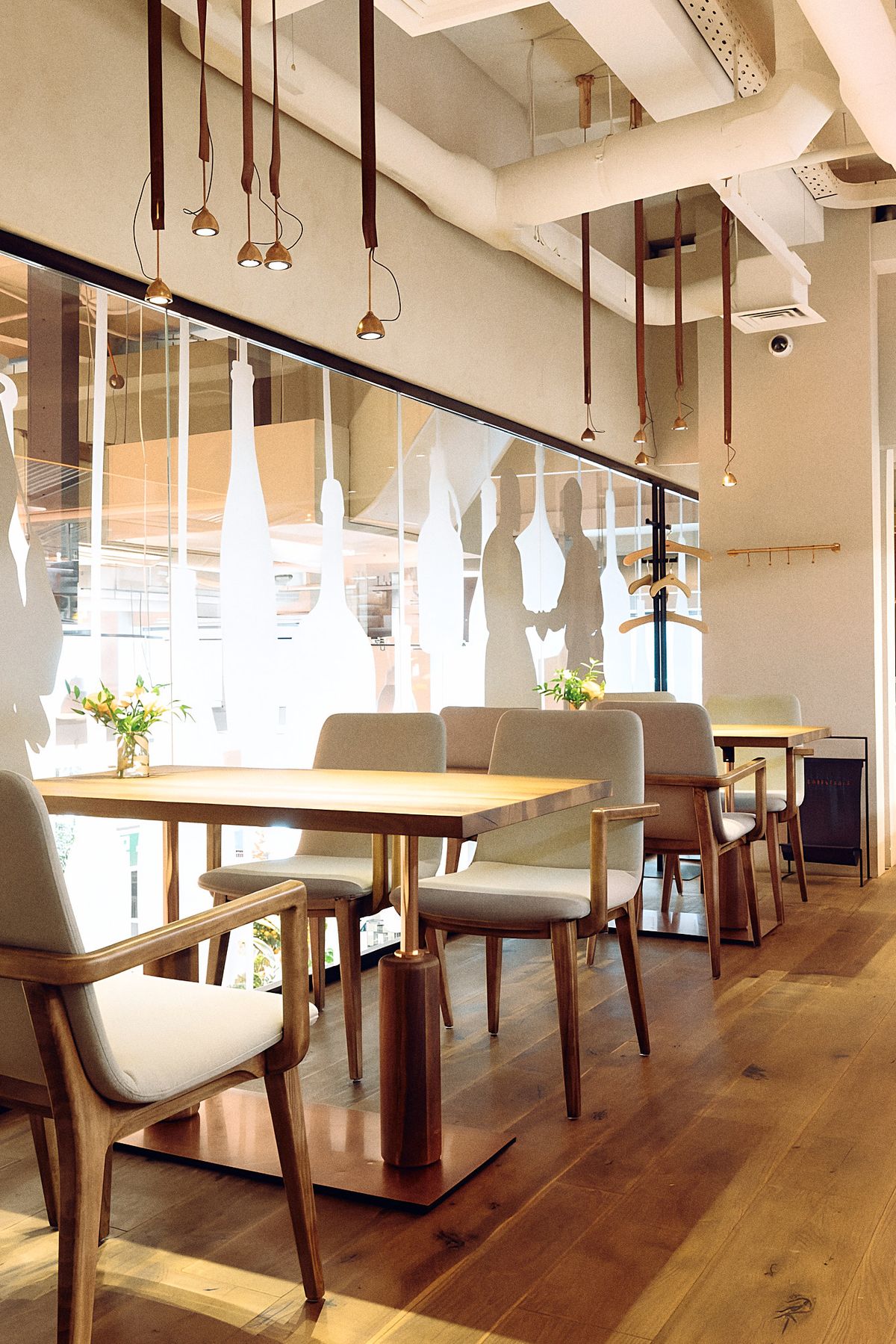 dining tables along glass partition