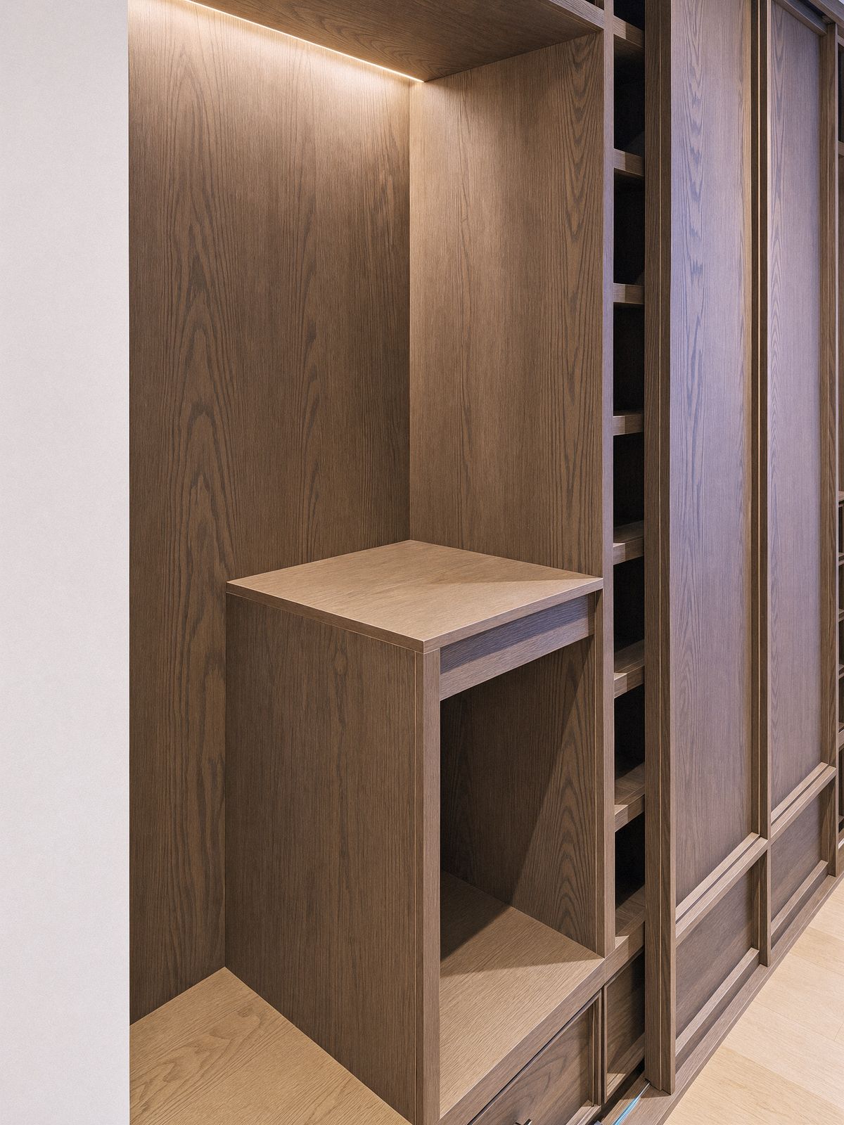floating oak shelf box in an open bay, lit from the top