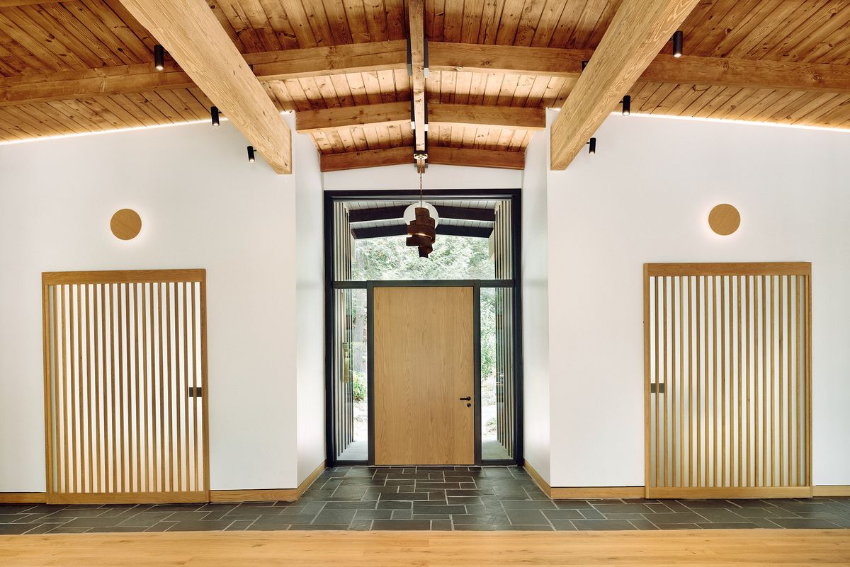 main entryway with wood doors