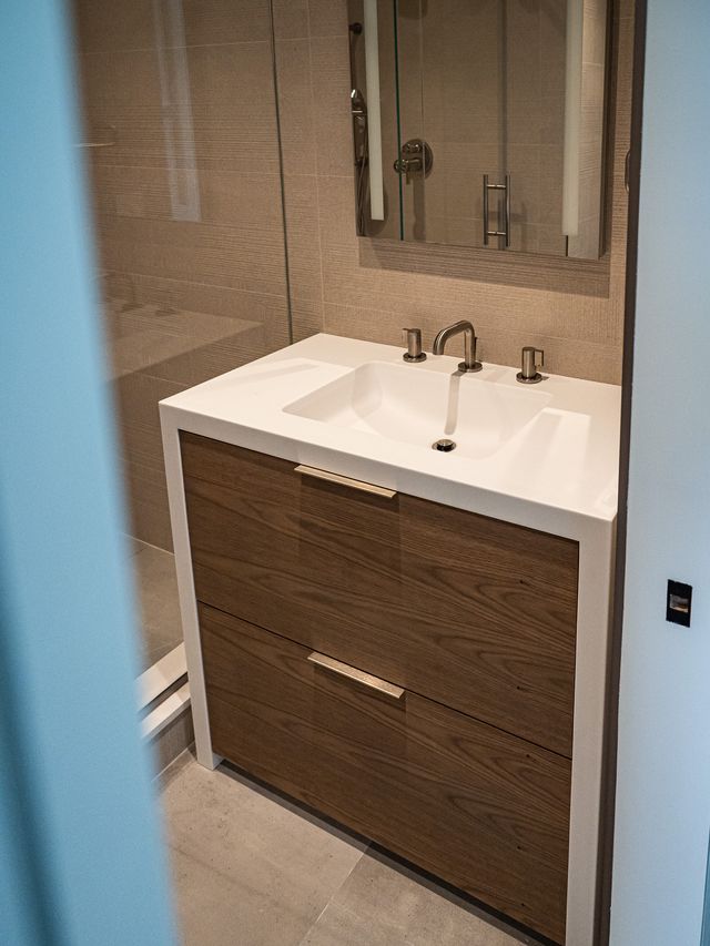 bathroom vanity with medicine cabinet and glass shower