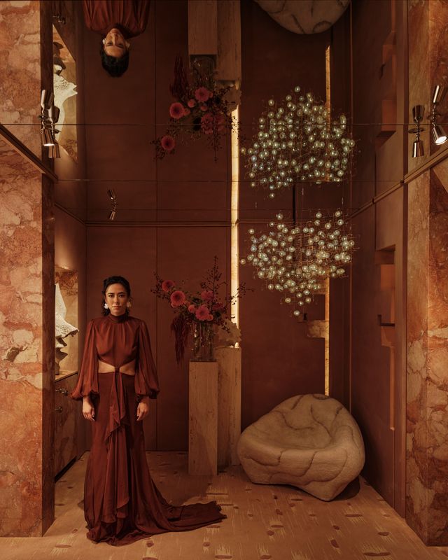 megan grehl standing in the annex beneath the mirrored ceiling