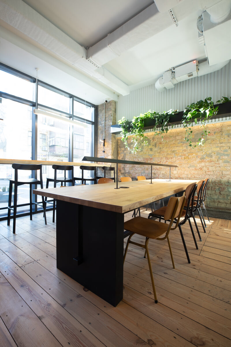 communal table with window bar counter and plant shelf