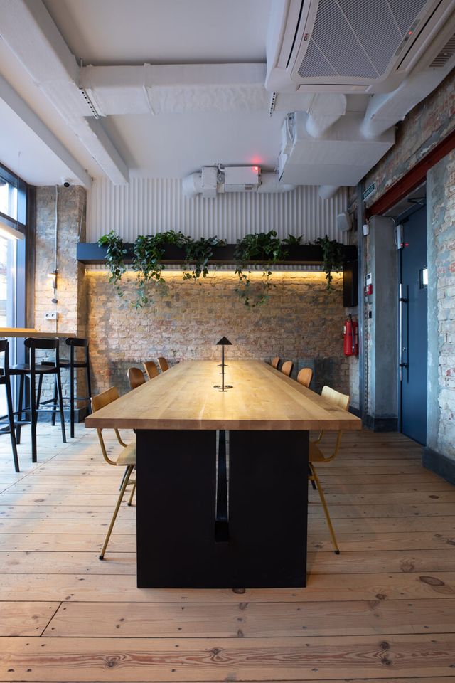 communal table end view with pyramid pendant lamp