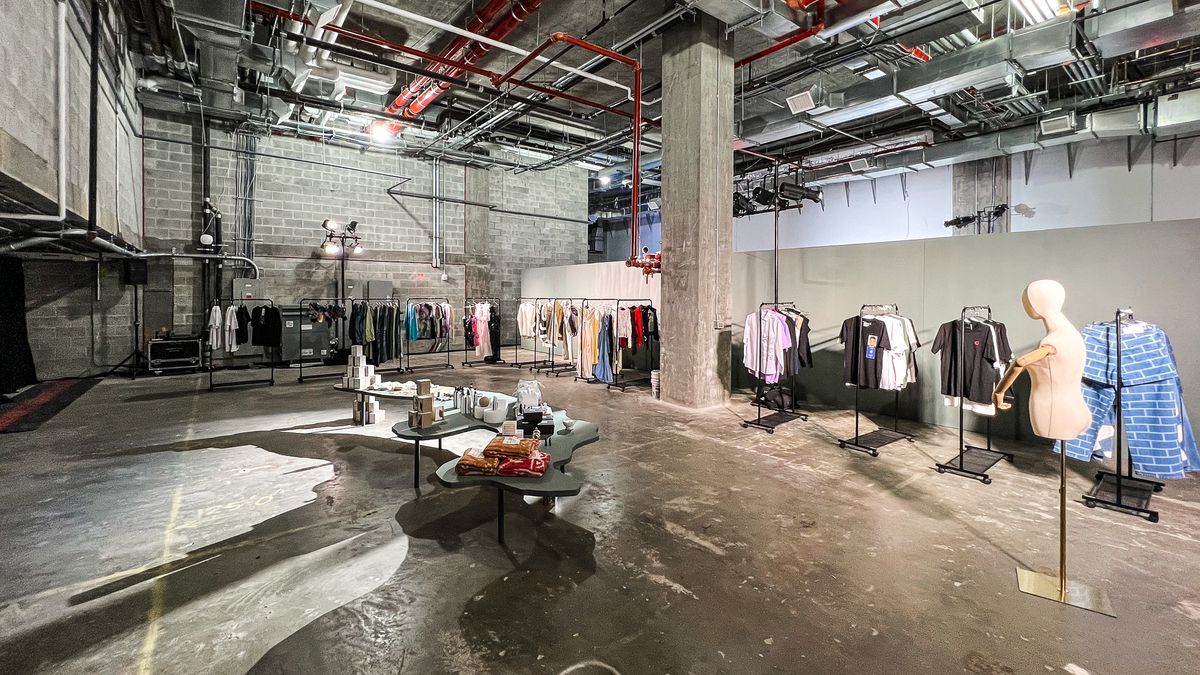 industrial pop-up shop with rolling garment racks
