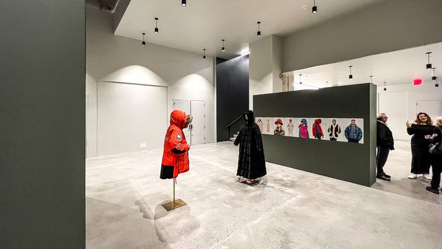 red and black coats displayed in concrete showroom