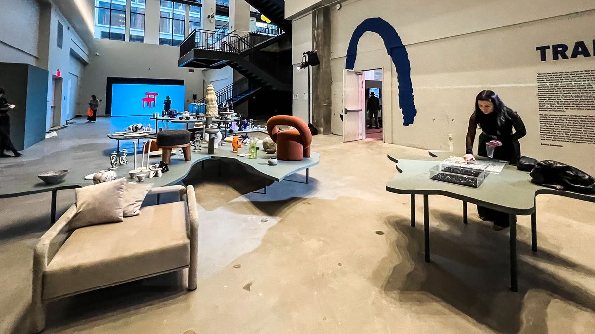 furniture exhibition with orange chair and blue screen