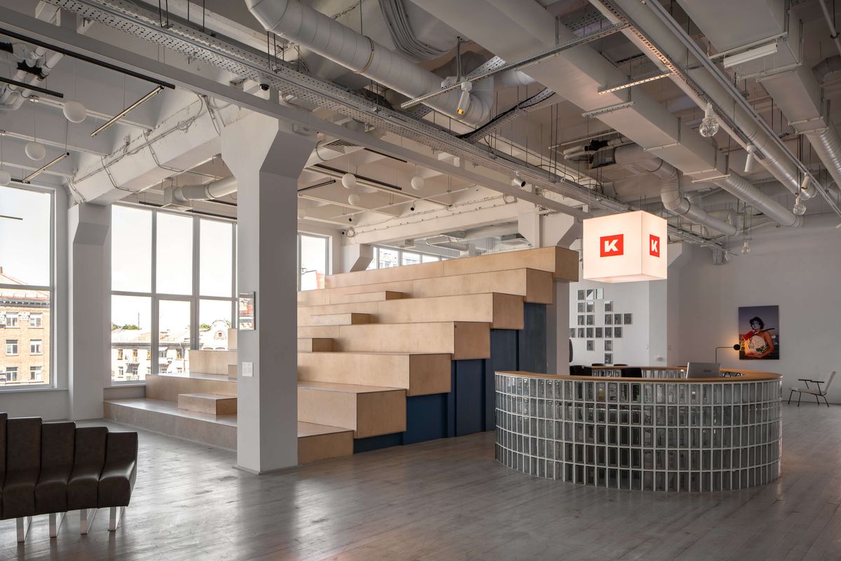 tiered wooden bleachers and glass block reception desk