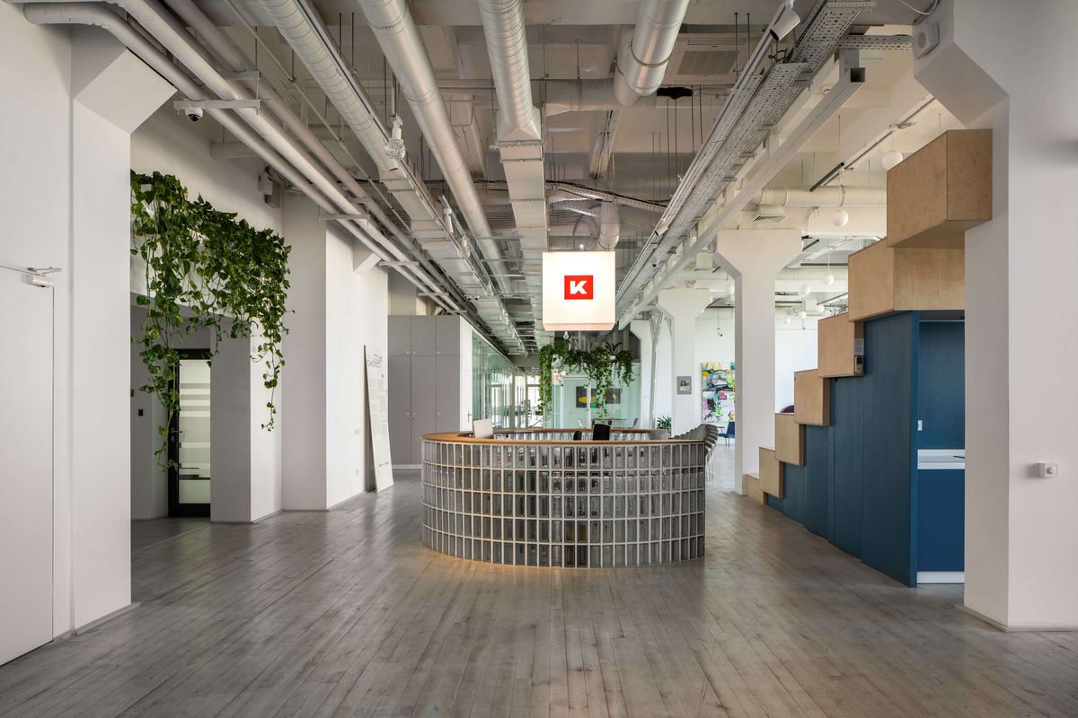 curved glass block reception with red k pendant sign