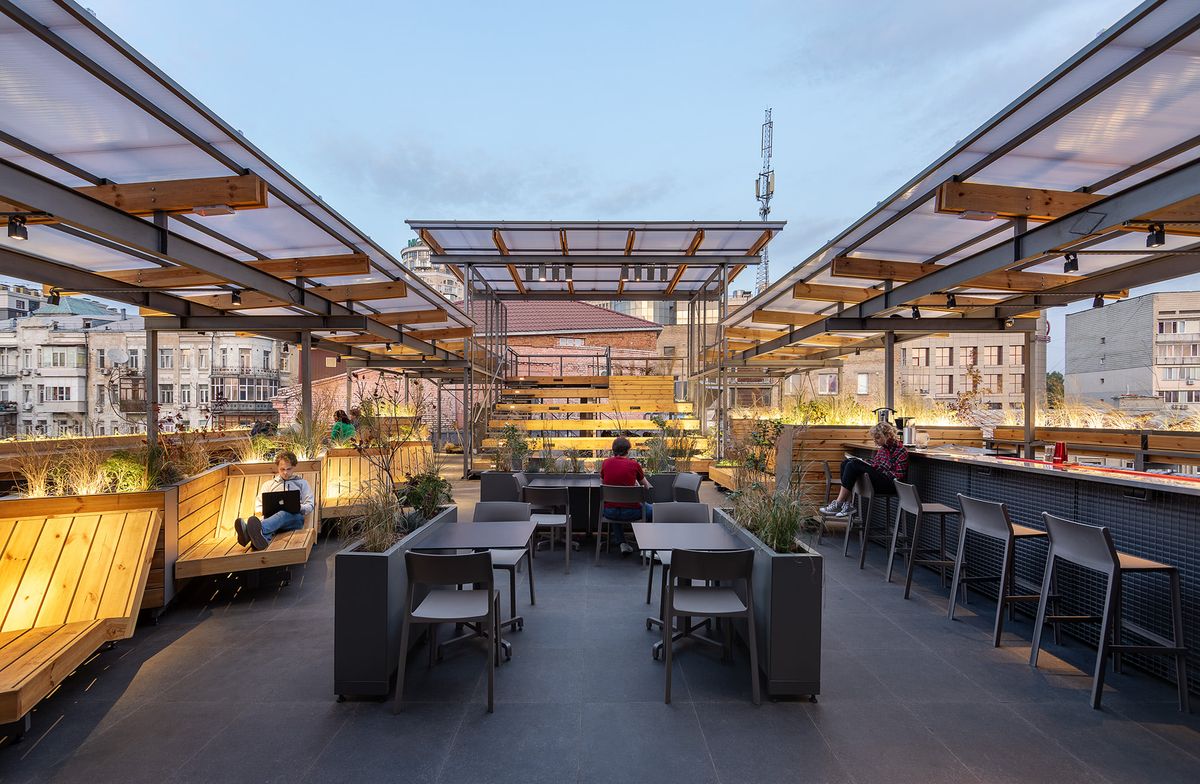 rooftop terrace seating under translucent roof panels