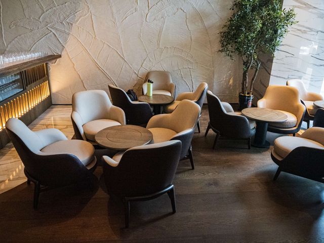 lounge seating beside backlit slat bar wall