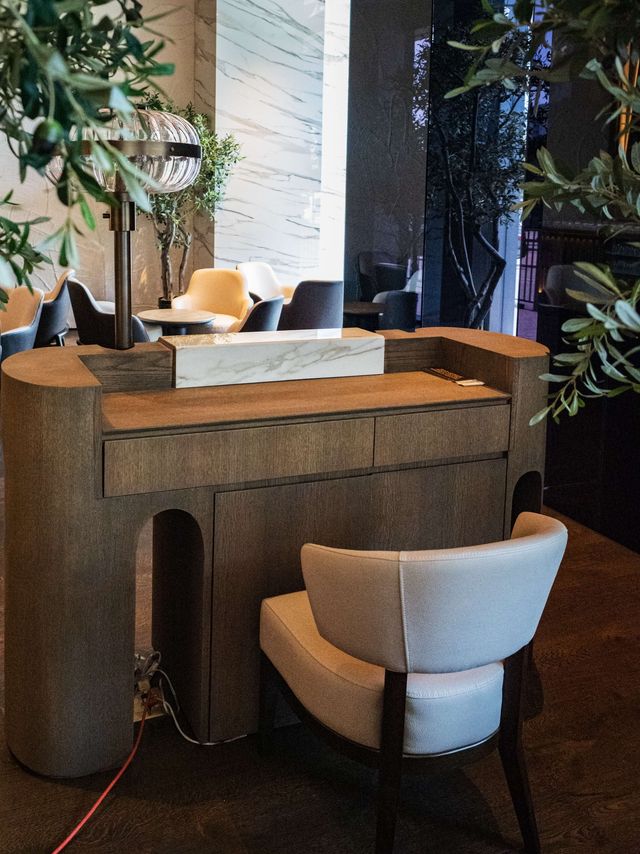 dark wood service desk with marble block accent