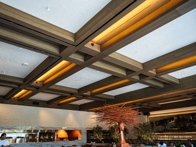 coffered wood ceiling with sculpture and pizza oven