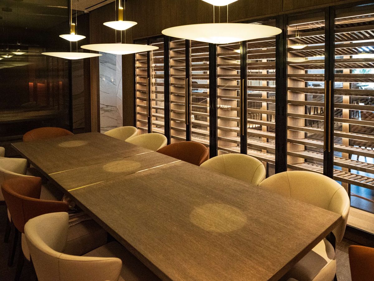 private dining table with backlit wine wall