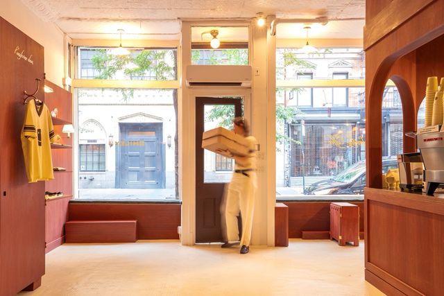 storefront interior with wood paneling and windows