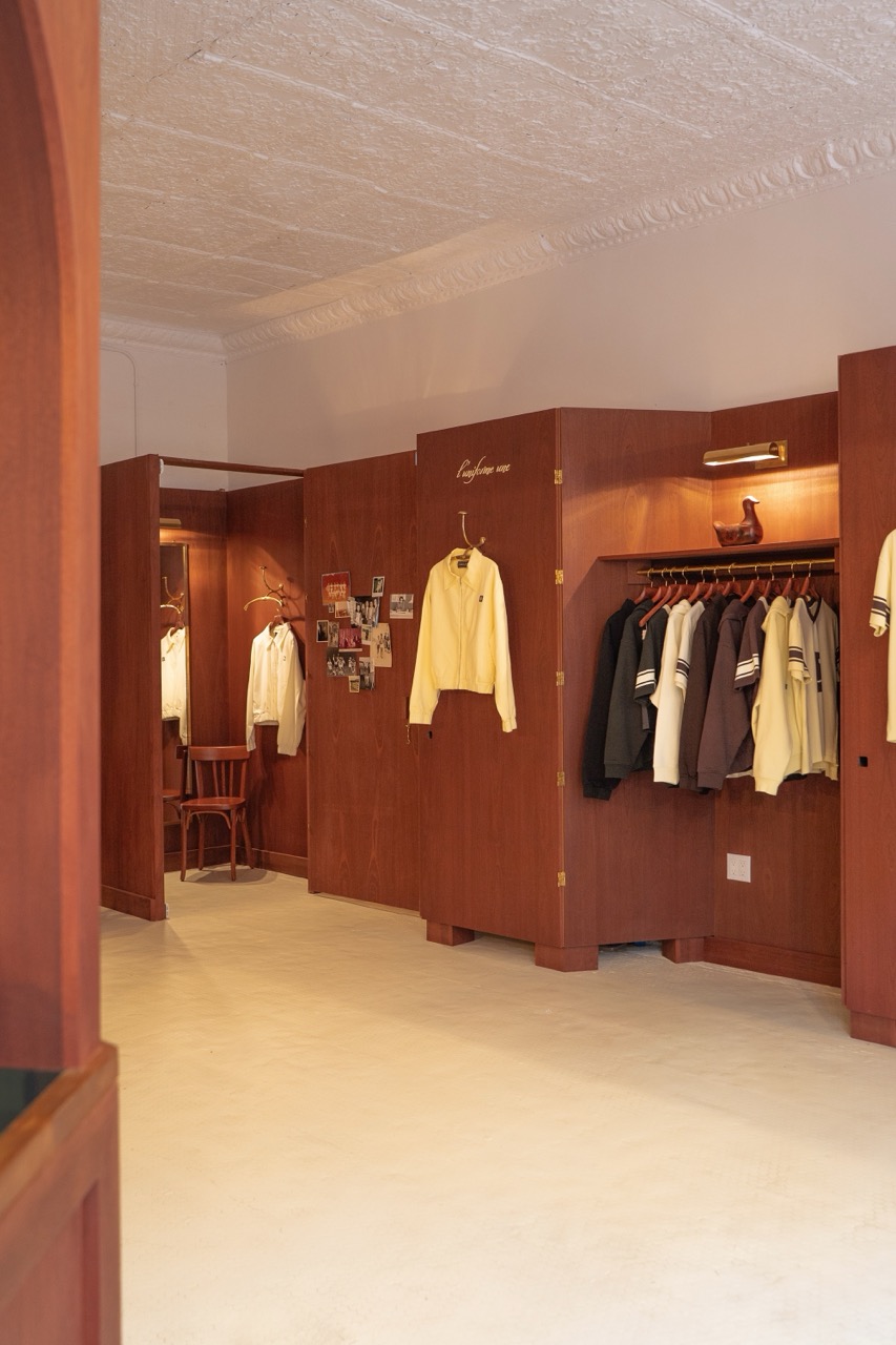 boutique interior with wood partitions and apparel