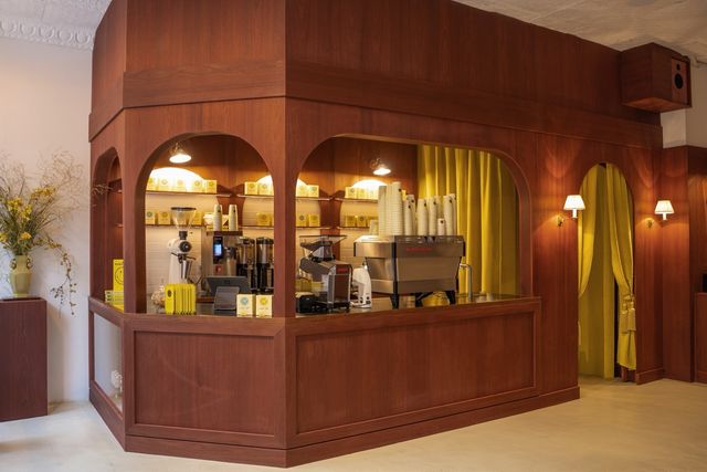 arched wood coffee bar with espresso equipment