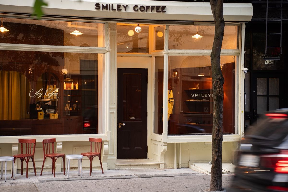 smiley coffee storefront exterior with sidewalk seating