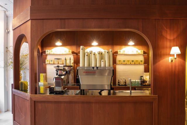 front view of arched wood espresso service counter
