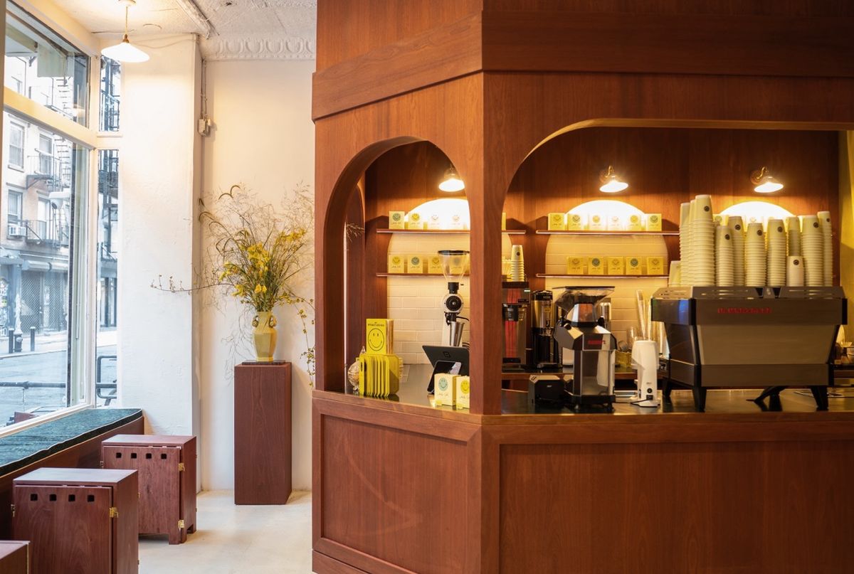 wood kiosk with arches facing streetfront window